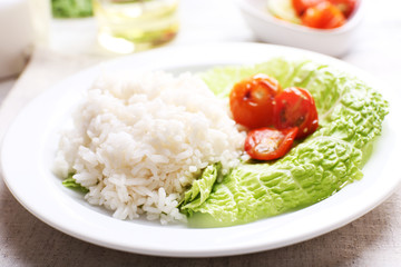 Boiled rice served on table, close-up