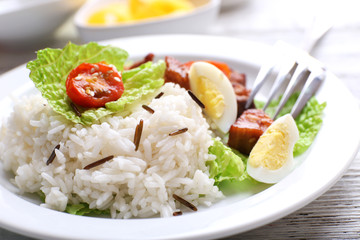 Boiled rice served on table, close-up