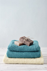Fototapeta na wymiar Towels with soap bars