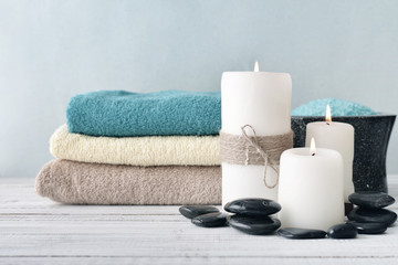 Candles with lavender flowers and towels