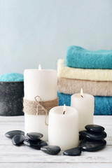 Fototapeta na wymiar Candles with bath towels