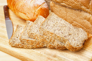 Rye bread slices on wooden table