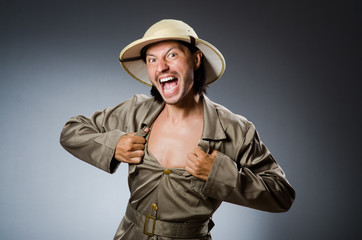 Funny safari hunter against background