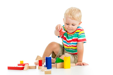 kid boy playing  wooden toys