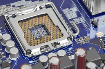 Printed computer motherboard, CPU socket, close up, DOF