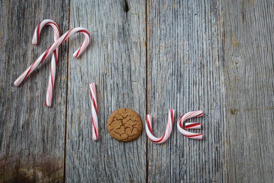 Candy Cane and Gingerbread cookie spelling the word love