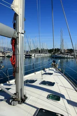 Zelfklevend Fotobehang view from super sail boat yacht in a marina  © William Richardson