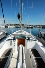 Fotobehang view from super sail boat yacht in a marina  © William Richardson