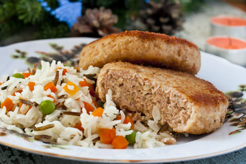 Fish cutlet with a side dish of rice