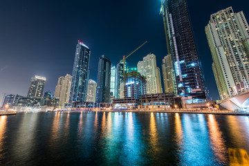 Fototapeta premium Dubai marina skyscrapers during night hours