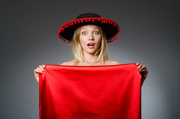 Woman wearing sombrero hat in funny concept