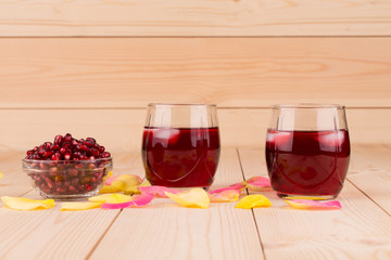 Opened pomegranate seeds and juice.