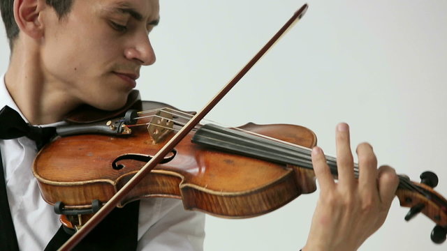 Latino violinist man on a white background.