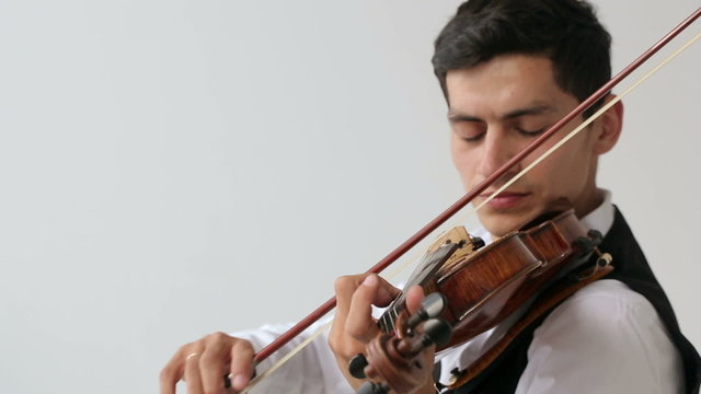 Latino violinist man on a white background.