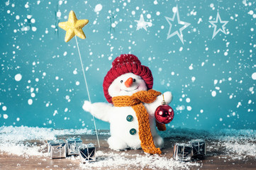 Small snowman with star and gifts