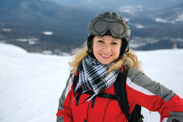 Winter sport, snowboarding - portrait of young snowboarder girl