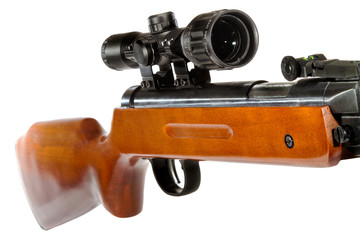 air rifle with a telescopic sight and a wooden butt