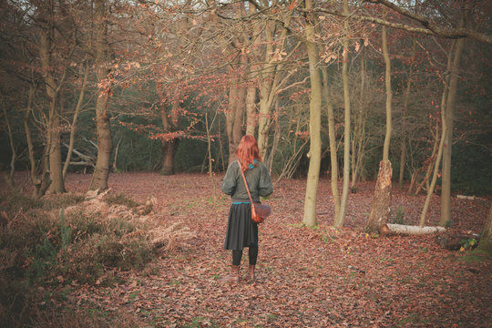 Woman standing in the forest