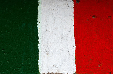 Flag of Italy on a concrete wall