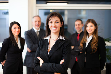 Businesswoman in front of a group of business people