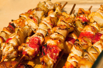 Roast chicken meat sticks on barbecue