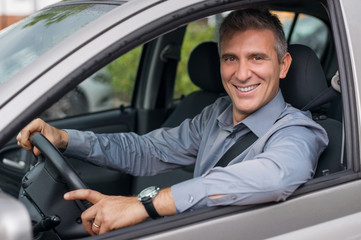 Happy Businessman Driving Car