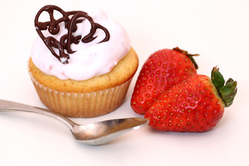 Delicious vanilla cupcake with strawberry frosting