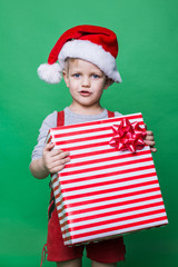 Christmas Elf holding big red gift box. Santa Claus helper