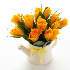 Bouquet of yellow roses in white watering can