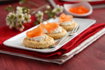 Canapes with oat bran cookies, smoked salmon and cream cheese