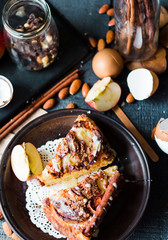 Christmas apple pie with cinnamon and nuts, frosting, top view