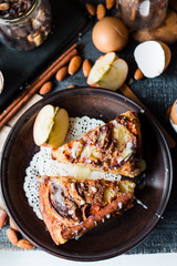 Christmas apple pie with cinnamon and nuts, frosting, top view