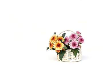 Obraz na płótnie Canvas Flower in wooden handmade basket isolated on white background