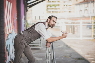 handsome big moustache hipster man smoking pipe