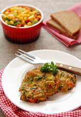 Homemade zucchini fritters with chorizo sausage and corn salsa