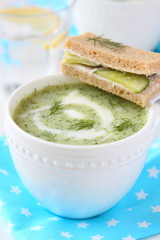 Cold cucumber-yogurt soup with dill, and cucumber sandwich