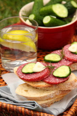 Sandwiches with smoked sausage and homemade salted cucumbers