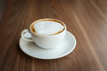 Coffee cup and book on the table