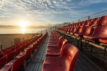 Fototapeta premium Empty plastic chairs at temporary grandstand stadium in Phuket,