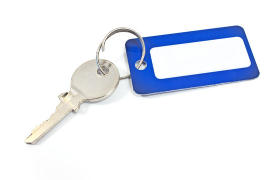 House key with blue tag isolated on white