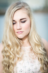 Naklejka premium Beautiful Blond Teenage Girl With Blue Eyes