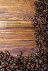 Coffee beans on wood background