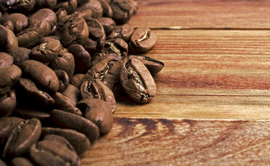 Coffee beans on wood background