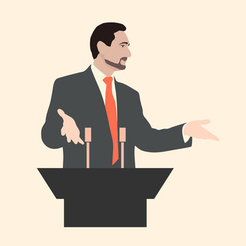 Orator stands behind a podium with microphones