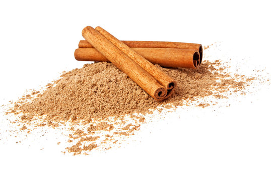 Cinnamon sticks and powder on a white background