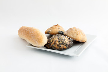 Composition of several breads isolated on white background