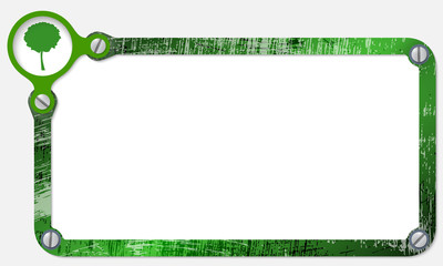 metal frame for text with screws and tree symbol
