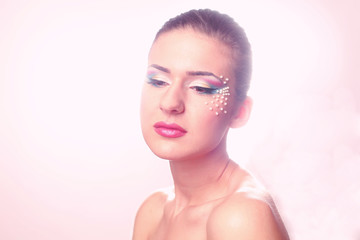 Portrait of beautiful woman with colorful make-up
