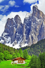 alpine scenery - wooden house in Dolomites, north of Italy