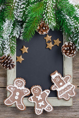 Obraz na płótnie Canvas Black board for text and gingerbread man, christmas concept
